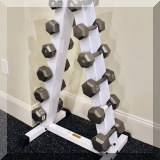 X04. Body Solid rack with dumbbells. 